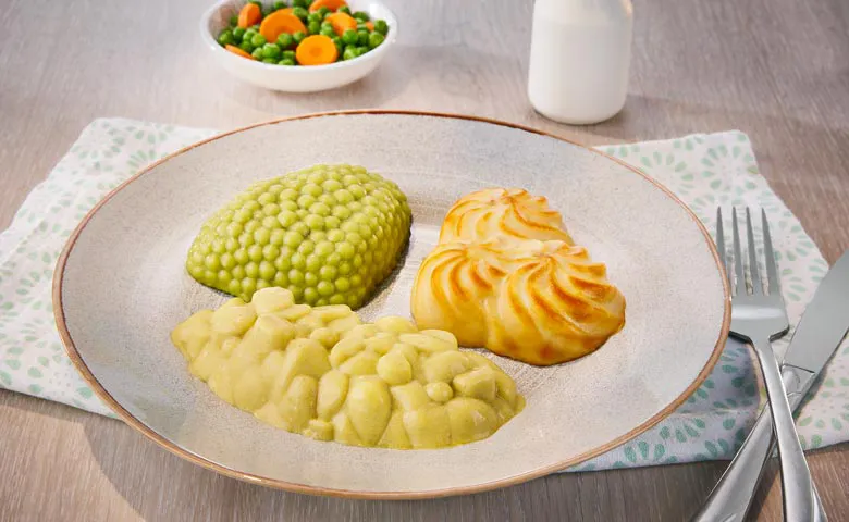 Pürierter Möhreneintopf mit vegetarischer Wurst (auf Basis von Gemüse und Sonnenblumenprotein)